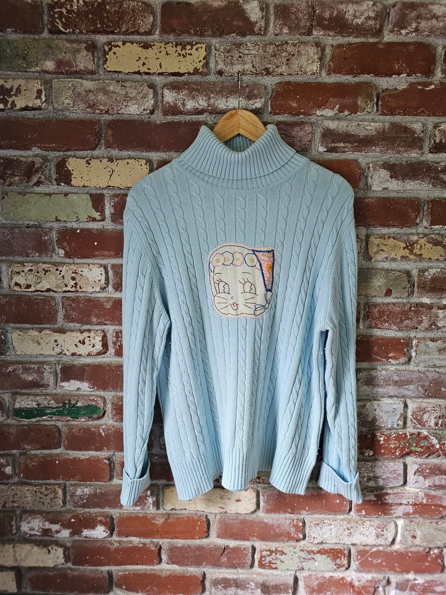 The "Fern" Upcycled Vintage Sweater - Upcycled Baby Blue Cableknit Turtleneck with Hand Embroidered Cat Patch