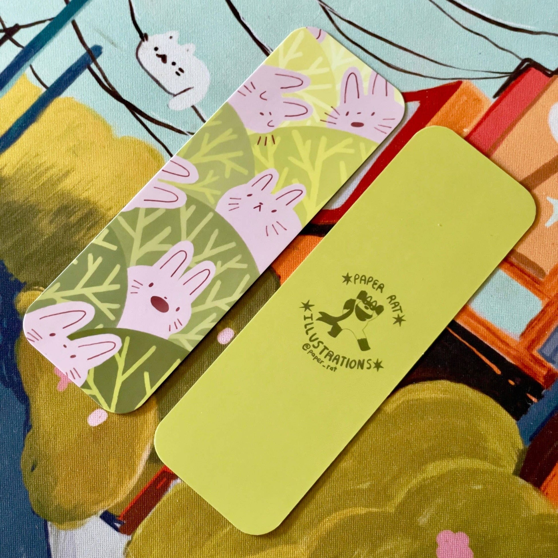 Colorful bookmarks with bunny cartoon designs on a textured surface