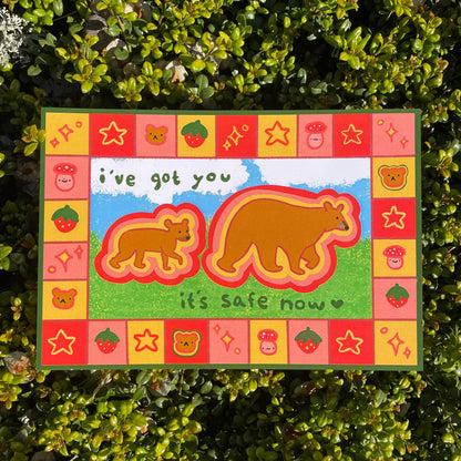 Print of two bears with text that reads "I've got you, it's safe now" on a green leaf background