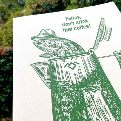 Illustration of a fish wearing a hat and in a coffee percolator that says "Fellas, don't drink that coffee!"