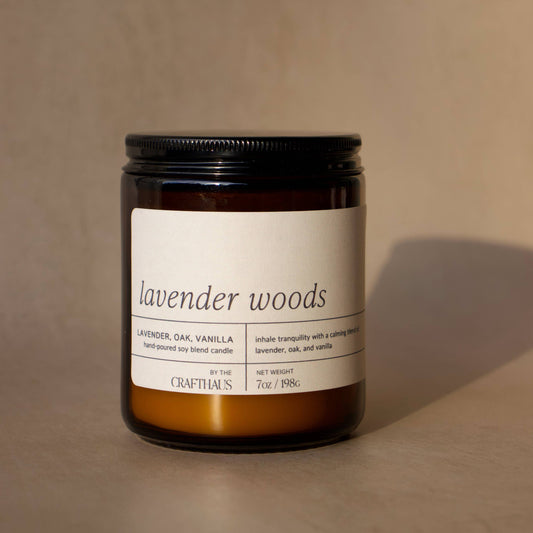 Candle labeled 'lavender woods' on a beige background