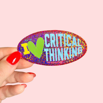 Colorful sticker with 'I ❤️ Critical Thinking' text held by a hand on a pink background