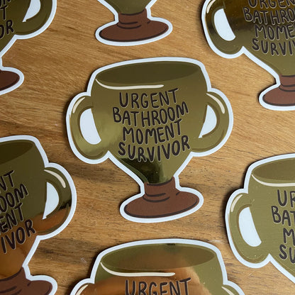 Urgent Bathroom Moment Survivor Metallic Gold Trophy Sticker