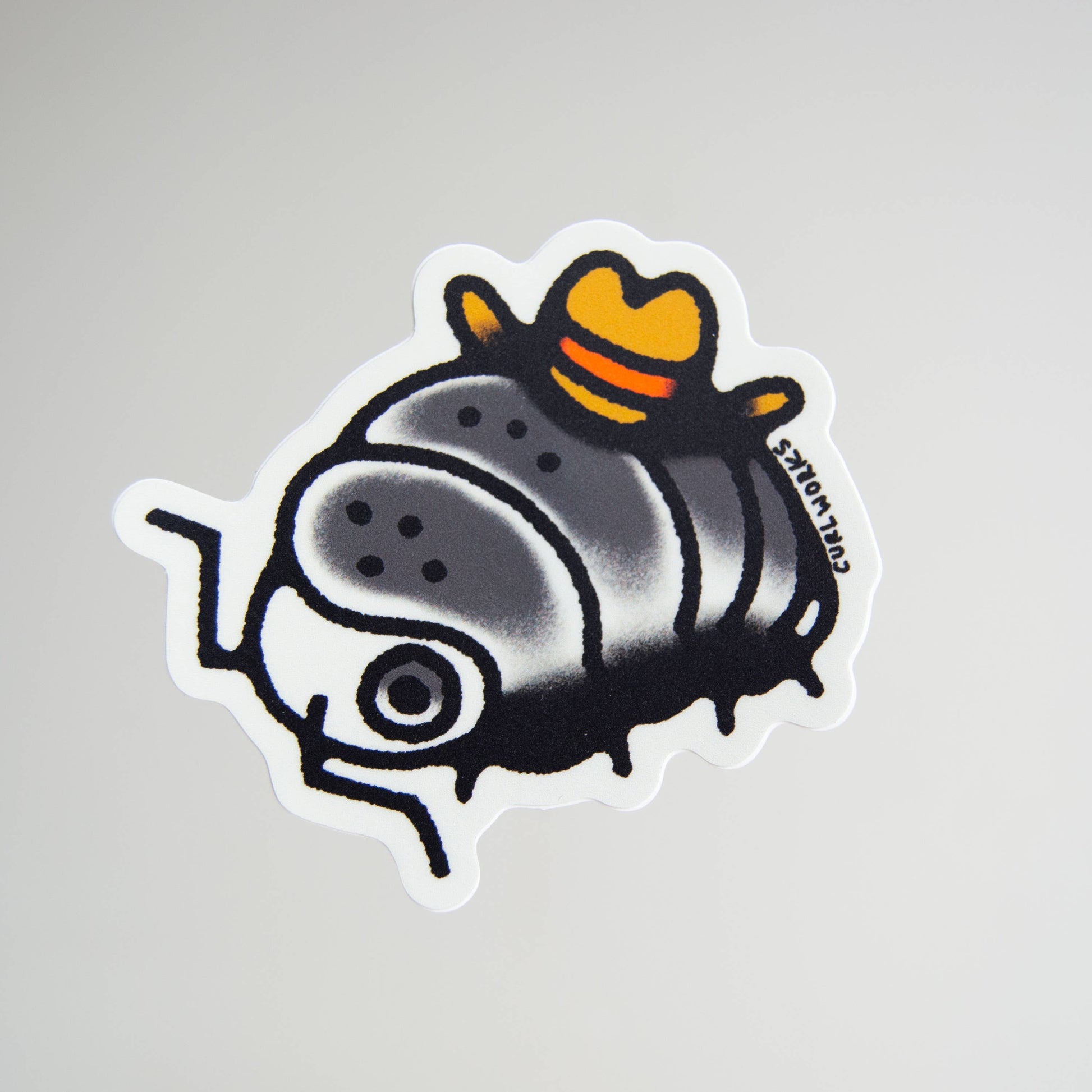 Sticker of a cartoonish pillbug wearing a yellow cowboy hat on a gray background