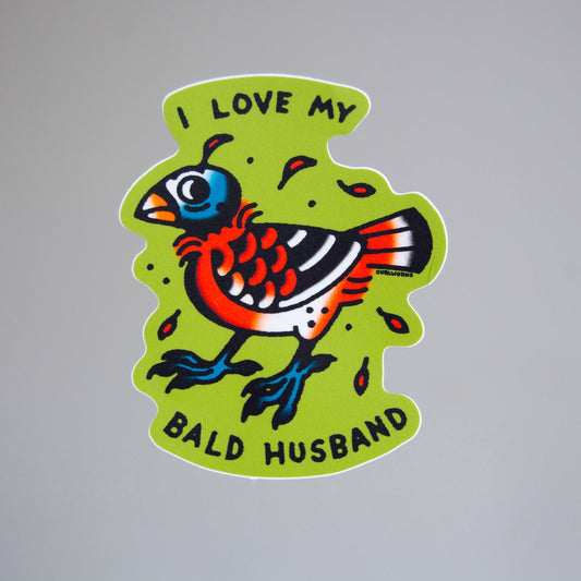 Colorful sticker with a bird design and text on a gray background